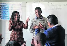 Bridging the gap: Pupils at the Emerald Hill School for the Deaf learning sign language. The majority of deaf people in Zimbabwe reportedly cannot read or write.