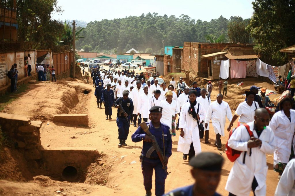 Doctors and health workers march through Butembo to strike indefinitely following the fatal shooting of Dr Richard Mouzoko Kiboung.